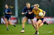 13 March 2025; Aobha Harmon of DCU Dóchas Éireann is tackled by Aine Bresnan of TUD during the 2025 AIG Moynihan Cup final match between TUD CC1 and DCU Dóchas Éireann at Queen's Sport in Belfast. Photo by Shauna Clinton/Sportsfile