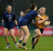 13 March 2025; Aobha Harmon of DCU Dóchas Éireann is tackled by Aine Bresnan of TUD during the 2025 AIG Moynihan Cup final match between TUD CC1 and DCU Dóchas Éireann at Queen's Sport in Belfast. Photo by Shauna Clinton/Sportsfile