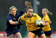 13 March 2025; Katelyn Rose Doherty of DCU Dóchas Éireann is tackled by Aine Bresnan of TUD during the 2025 AIG Moynihan Cup final match between TUD CC1 and DCU Dóchas Éireann at Queen's Sport in Belfast. Photo by Shauna Clinton/Sportsfile