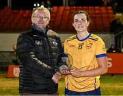 13 March 2025; Niamh McCorry of DCU Dóchas Éireann is presented with the Player of the Match award by Vice Chairperson of the HEC Con Moynihan following her performance in the 2025 AIG Moynihan Cup final match between TUD CC1 and DCU Dóchas Éireann at Queen's University in Belfast. Photo by Shauna Clinton/Sportsfile