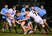 13 March 2025; Tom O'Riordan of UCD is tackled by Dylan Ryan of Dublin University, 7, during the annual men’s Rugby Colours match between Dublin University and UCD at UCD Bowl in Dublin. Photo by Sam Barnes/Sportsfile