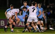 13 March 2025; Matthew Healy of UCD is tackled by, from left, Jack Kearney, Dylan Ryan and Dave Walsh of Dublin University during the annual men’s Rugby Colours match between Dublin University and UCD at UCD Bowl in Dublin. Photo by Sam Barnes/Sportsfile