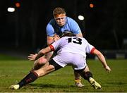 13 March 2025; Chris Hennessy of UCD in action against Louis McDonough of Dublin University during the annual men’s Rugby Colours match between Dublin University and UCD at UCD Bowl in Dublin. Photo by Sam Barnes/Sportsfile