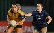 13 March 2025; Aine Smith of DCU Dóchas Éireann is tackled by Shannon Russell of TUD during the 2025 AIG Moynihan Cup final match between TUD CC1 and DCU Dóchas Éireann at Queen's Sport in Belfast. Photo by Shauna Clinton/Sportsfile