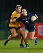 13 March 2025; Shannon Russell of TUD is tackled by Ellen Canavan of DCU Dóchas Éireann during the 2025 AIG Moynihan Cup final match between TUD CC1 and DCU Dóchas Éireann at Queen's Sport in Belfast. Photo by Shauna Clinton/Sportsfile