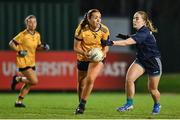 13 March 2025; Aine Smith of DCU Dóchas Éireann is tackled by Shannon Russell of TUD during the 2025 AIG Moynihan Cup final match between TUD CC1 and DCU Dóchas Éireann at Queen's Sport in Belfast. Photo by Shauna Clinton/Sportsfile