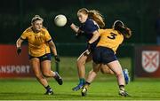 13 March 2025; Shannon Russell of TUD is tackled by Riane McGrath of DCU Dóchas Éireann during the 2025 AIG Moynihan Cup final match between TUD CC1 and DCU Dóchas Éireann at Queen's Sport in Belfast. Photo by Shauna Clinton/Sportsfile