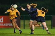 13 March 2025; Shannon Russell of TUD is tackled by Riane McGrath of DCU Dóchas Éireann during the 2025 AIG Moynihan Cup final match between TUD CC1 and DCU Dóchas Éireann at Queen's Sport in Belfast. Photo by Shauna Clinton/Sportsfile