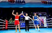 13 March 2025; Aoife O’Rourke of Ireland has her hand raised to be judged the winner over Aziza Zokirova of Uzbekistan in their 70-75kg Elite Women Quarter-Final bout during the 2025 IBA Women's World Boxing Championships quarter-finals at the Cair Sports Center in Niš, Serbia. Photo by Nikola Krstic/Sportsfile