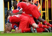 6 October 2013; Alan Keane, bottom, Sligo Rovers, celebrates after scoring his side's second goal with team-mates Aaron Greene, Danny Ventre and Joseph Ndo. FAI Ford Cup, Semi-Final, Sligo Rovers v Shamrock Rovers, The Showgrounds, Sligo. Picture credit: David Maher / SPORTSFILE