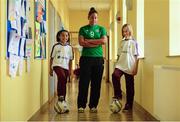8 October 2013; 10 year old Kayla Smith, left, and 11 year old Sara Celejewska, pupils at St. John of God National School, Wexford, and Irish International footballer Rianna Jarrett, in attendance at St. John of God NS in Wexford for the launch of the Aviva Soccer Sisters Halloween Camps. The camps will take place over the Halloween Break and are open to all girls between the ages of 7 and 12 years old. For more information log on to www.AVIVA.ie/SoccerSisters. St John of God National School, The Faythe, Wexford. Photo by Sportsfile