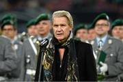 11 October 2013; Johnny Logan sings the National Anthem before the game. 2014 FIFA World Cup Qualifier, Group C, Germany v Republic of Ireland, Rhine Energie Stadion, Cologne, Germany.  Picture credit: David Maher / SPORTSFILE