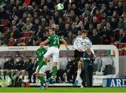 11 October 2013; Kevin Doyle, Republic of Ireland, in action against Thomas Müller, Germany. 2014 FIFA World Cup Qualifier, Group C, Germany v Republic of Ireland, Rhine Energie Stadion, Cologne, Germany.  Picture credit: David Maher / SPORTSFILE