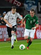 11 October 2013; Glenn Whelan, Republic of Ireland, in action against Marcell Jansen, Germany. 2014 FIFA World Cup Qualifier, Group C, Germany v Republic of Ireland, Rhine Energie Stadion, Cologne, Germany. Picture credit: David Maher / SPORTSFILE