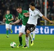 11 October 2013; James McCarthy, Republic of Ireland, in action against Sami Khedira, Germany. 2014 FIFA World Cup Qualifier, Group C, Germany v Republic of Ireland, Rhine Energie Stadion, Cologne, Germany.  Picture credit: David Maher / SPORTSFILE