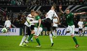 11 October 2013; Kevin Doyle, left, and Glenn Whelan, Republic of Ireland, in action against Marcell Jansen, Germany. 2014 FIFA World Cup Qualifier,  Group C, Germany v Republic of Ireland, Rhine Energie Stadion, Cologne, Germany. Picture credit: David Maher / SPORTSFILE