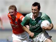 7 August 2004; Stephen Maguire, Fermanagh, in action against Francie Bellew, Armagh. Bank of Ireland All-Ireland Senior Football Championship Quarter Final, Armagh v Fermanagh, Croke Park, Dublin. Picture credit; Brendan Moran / SPORTSFILE