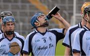 13 October 2013; Nenagh Éire Óg midfielder Kevin Tucker enjoys a drink during the pre-match parade. Tipperary County Senior Club Hurling Championship Final, Loughmore - Castleiney v Nenagh Éire Óg, Semple Stadium Thurles, Co. Tipperary. Picture credit: Ray McManus / SPORTSFILE