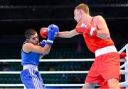 15 October 2013; Sean McComb, Holy Trinity BC, Belfast, representing Ireland, right, exchanges punches with Almog Briga, Israel, during their Men's Lightweight 60Kg Last 64 bout. AIBA World Boxing Championships Almaty 2013, Almaty, Kazakhstan. Photo by Sportsfile