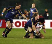 1 October 2004; Sione Tuipulotu, The Dragons, is tackled by Brian O'Driscoll, Leinster. Celtic League 2004-2005, The Dragons v Leinster, Rodney Parade, Newport, Wales. Picture credit; Tim Parfitt / SPORTSFILE