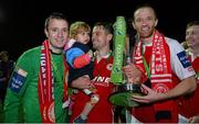 18 October 2013; Brendan Clarke, left, Ger O'Brien, with his daughter Hannah, age 2, and Aidan Price, St. Patrick’s Athletic, celebrate at the end of the game. Airtricity League Premier Division, St. Patrick’s Athletic v Derry City, Richmond Park, Dublin. Picture credit: David Maher / SPORTSFILE