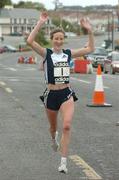 10 October 2004; Catherina McKiernan crosses the line to win the Annalee AC 10K road race. Annalee, Co. Cavan. Picture credit; Pat Murphy / SPORTSFILE