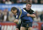 10 October 2004; Filipe Contepomi, Leinster, is tackled by Brendan Laney, Edinburgh Rugby. Celtic League 2004-2005, Leinster v Edinburgh Rugby, Donnybrook, Dublin. Picture credit; Brendan Moran / SPORTSFILE