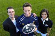 14 October 2004; Leinster's Gary Brown who was presented with the Guinness Celtic League player of the month award for September by Ronan Beirne, left, Guinness Brand Manager, in the company of model Martha Christie. Old Belvedere Rugby Club, Dublin. Picture credit; Brendan Moran / SPORTSFILE