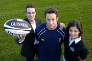 14 October 2004; Leinster's Gary Brown who was presented with the Guinness Celtic League player of the month award for September by Ronan Beirne, left, Guinness Brand Manager, in the company of model Martha Christie. Old Belvedere Rugby Club, Dublin. Picture credit; Brendan Moran / SPORTSFILE