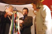 13 October 2004; Sean Kelly, President of the GAA, takes a close look at the Eileen Dubhthaigh Ui Mhathuna cup with Eileen Duffy O'Mahony, who donated the cup for the first ever Coca Cola International Camogie Competition, and Miriam O'Callaghan, President of the Camogie Association, right, at the launch of the 2004 Coca Cola International camogie competition between Ireland, An Bhreatain, and USA. Citywest Hotel, Dublin. Picture credit; Pat Murphy / SPORTSFILE