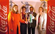 13 October 2004; At the launch of the 2004 Coca Cola International camogie competition between Ireland, An Bhreatain, and USA are, from l to r; Mo Durcan, Coca Cola Public Affairs and Communications Manager, Chris Hanley, USA captain, Séan Kelly, President of the GAA, Miriam O'Callaghan, President of the Camogie Association, with the Eileen Dubhthaigh Ui Mhathuna cup. Citywest Hotel, Dublin. Picture credit; Pat Murphy / SPORTSFILE