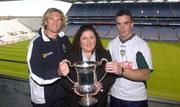 15 October 2004; Bridget McAnallen holds the cup named after her late son Cormac McAnallen with Australian captain James Hird, left and Ireland captain Padraic Joyce after a joint AFL/GAA Press Briefing ahead of this weekend's Coca Cola International Rules Series 2004. Croke Park, Dublin. Picture credit; Damien Eagers / SPORTSFILE