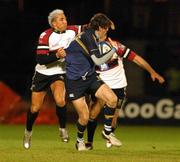 15 October 2004; Shane Horgan, Leinster, is tackled by Ospreys defender Gavin Henson. Celtic League 2004-2005, Neath / Swansea Ospreys v Leinster, St. Helens, Wales. Picture credit; Tim Parfitt / SPORTSFILE