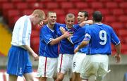 16 October 2004; Linfield's Aidan O Kane celebrates after scoring his sides first goal with team-mates David Thompson and Michael Gault. Irish League, Linfield v Coleraine, Windsor Park, Belfast. Picture credit; SPORTSFILE
