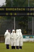 14 October 2004; The Umpires talk beneath the scoreboard showing Britian 1-8 - USA 0-01, International Camogie Competition, USA v Britain, Parnell Park, Dublin. Picture credit; Damien Eagers / SPORTSFILE