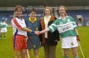 14 October 2004; USA captain Christina Hanley, left, shakes hands with British captain Anne Marie O'Dwyer with referee Ann Derham and Miriam O'Callaghan, President of the camogie association. International Camogie Competition, USA v Britain, Parnell Park, Dublin. Picture credit; Damien Eagers / SPORTSFILE