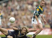 24 October 2004; Brendan Coluter, Ireland, in action against Mark McVeigh, Australia. Coca Cola International Rules Series 2004, Second Test, Ireland v Australia, Croke Park, Dublin. Picture credit; Damien Eagers / SPORTSFILE *** Local Caption *** Any photograph taken by SPORTSFILE during, or in connection with, the 2004 Coca Cola International Rules Series which displays GAA logos or contains an image or part of an image of any GAA intellectual property, or, which contains images of a GAA player/players in their playing uniforms, may only be used for editorial and non-advertising purposes.  Use of photographs for advertising, as posters or for purchase separately is strictly prohibited unless prior written approval has been obtained from the Gaelic Athletic Association.