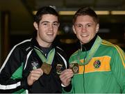 27 October 2013; Ireland's Jason Quigley, right, from Finn Valley BC, Donegal, with his AIBA World Boxing Championships silver medal, and Joe Ward, Moate BC, Co. Westmeath, with his bronze medal on their arrival home from the AIBA World Boxing Championships Almaty 2013 in Kazakhstan. Dublin Airport, Dublin. Photo by Sportsfile