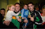 27 October 2013; Ireland's Jason Quigley, left, from Finn Valley BC, Donegal, with his AIBA World Boxing Championships silver medal and his six year old sister Holli, and Ireland's Joe Ward with his bronze medal and two year old son Joe, on their arrival home from the AIBA World Boxing Championships Almaty 2013 in Kazakhstan.n. Dublin Airport, Dublin. Photo by Sportsfile