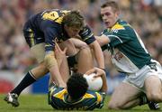 24 October 2004; Sean Og O hAilpin, Ireland, tussles with Jude Bolton, Australia, as Martin McGrath, Ireland, comes to his assistance. Coca Cola International Rules Series 2004, Second Test, Ireland v Australia, Croke Park, Dublin. Picture credit; Brendan Moran / SPORTSFILE *** Local Caption *** Any photograph taken by SPORTSFILE during, or in connection with, the 2004 Coca Cola International Rules Series which displays GAA logos or contains an image or part of an image of any GAA intellectual property, or, which contains images of a GAA player/players in their playing uniforms, may only be used for editorial and non-advertising purposes.  Use of photographs for advertising, as posters or for purchase separately is strictly prohibited unless prior written approval has been obtained from the Gaelic Athletic Association.