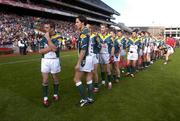 24 October 2004; The Irish team, led by captain Padraic Joyce, left, get ready for the parade before the game. Coca Cola International Rules Series 2004, Second Test, Ireland v Australia, Croke Park, Dublin. Picture credit; Brendan Moran / SPORTSFILE *** Local Caption *** Any photograph taken by SPORTSFILE during, or in connection with, the 2004 Coca Cola International Rules Series which displays GAA logos or contains an image or part of an image of any GAA intellectual property, or, which contains images of a GAA player/players in their playing uniforms, may only be used for editorial and non-advertising purposes.  Use of photographs for advertising, as posters or for purchase separately is strictly prohibited unless prior written approval has been obtained from the Gaelic Athletic Association.