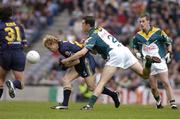 24 October 2004; Michael Braun, Australia, in action against Joe Bergin, Ireland. Coca Cola International Rules Series 2004, Second Test, Ireland v Australia, Croke Park, Dublin. Picture credit; Brendan Moran / SPORTSFILE *** Local Caption *** Any photograph taken by SPORTSFILE during, or in connection with, the 2004 Coca Cola International Rules Series which displays GAA logos or contains an image or part of an image of any GAA intellectual property, or, which contains images of a GAA player/players in their playing uniforms, may only be used for editorial and non-advertising purposes.  Use of photographs for advertising, as posters or for purchase separately is strictly prohibited unless prior written approval has been obtained from the Gaelic Athletic Association.