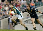 24 October 2004; Dessie Dolan, Ireland, in action against Luke Ball, Australia. Coca Cola International Rules Series 2004, Second Test, Ireland v Australia, Croke Park, Dublin. Picture credit; Brendan Moran / SPORTSFILE *** Local Caption *** Any photograph taken by SPORTSFILE during, or in connection with, the 2004 Coca Cola International Rules Series which displays GAA logos or contains an image or part of an image of any GAA intellectual property, or, which contains images of a GAA player/players in their playing uniforms, may only be used for editorial and non-advertising purposes.  Use of photographs for advertising, as posters or for purchase separately is strictly prohibited unless prior written approval has been obtained from the Gaelic Athletic Association.