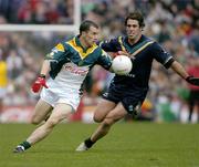 24 October 2004; Dessie Dolan, Ireland, in action against Dean Solomon, Australia. Coca Cola International Rules Series 2004, Second Test, Ireland v Australia, Croke Park, Dublin. Picture credit; Brendan Moran / SPORTSFILE *** Local Caption *** Any photograph taken by SPORTSFILE during, or in connection with, the 2004 Coca Cola International Rules Series which displays GAA logos or contains an image or part of an image of any GAA intellectual property, or, which contains images of a GAA player/players in their playing uniforms, may only be used for editorial and non-advertising purposes.  Use of photographs for advertising, as posters or for purchase separately is strictly prohibited unless prior written approval has been obtained from the Gaelic Athletic Association.