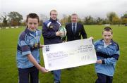 2 November 2004; Pictured at the presentation of a cheque for €10,000 as part of the IRFU's Player Development Rewards Programme are Leinster and Barnhall player Brendan Burke, Barnhall President Frank Cullen and Barnhall Junior players Thomas McGurk, left, U12 team, and Shane Carroll, U11 team. The programme is aimed directly at rewarding schools and clubs for nurturing the rugby talent of players who are now part of the professional system with the Irish provinces. Barnhall RFC, Leixlip, Co Kildare. Picture credit; Ray McManus / SPORTSFILE