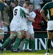 13 November 2004; Ireland's Ronan O'Gara, centre, is congratulated on scoring his sides first try by team-mates Simon Easterby (6) and Brian O'Driscoll. Rugby International, Ireland v South Africa, Lansdowne Road, Dublin. Picture credit; Brendan Moran / SPORTSFILE