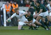 13 November 2004; Brian O'Driscoll, Ireland, is tackled by Jaco van der Westhuizen, South Africa. Rugby International, Ireland v South Africa, Lansdowne Road, Dublin. Picture credit; Brendan Moran / SPORTSFILE