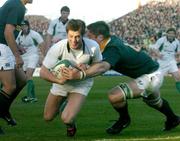 13 November 2004; Ronan O'Gara, Ireland, scores a try despite being tackled by  John Bakkies Botha. Rugby International, Ireland v South Africa, Lansdowne Road, Dublin. Picture credit; Matt Browne / SPORTSFILE
