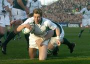 13 November 2004; Ronan O'Gara, Ireland, scores a try despite the tackle of John Bakkies Botha, South Africa. Rugby International, Ireland v South Africa, Lansdowne Road, Dublin. Picture credit; Matt Browne / SPORTSFILE