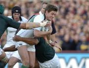 13 November 2004; Ronan O'Gara, Ireland, is tackled by Eddie Andrews and Victor Matfield, left, South Africa. Rugby International, Ireland v South Africa, Lansdowne Road, Dublin. Picture credit; Matt Browne / SPORTSFILE
